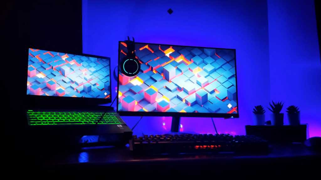 rgb workstation setup with a gaming laptop and external monitor